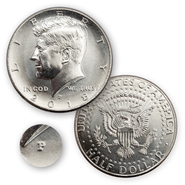 2018 Kennedy half dollar grading strip — four coins shown side by side from worn condition through Gem Uncirculated MS67, illustrating condition progression